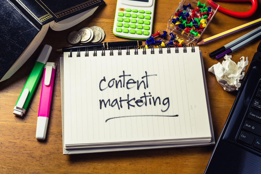 Handwritten note with the words content marketing on it showcase a business strategy
