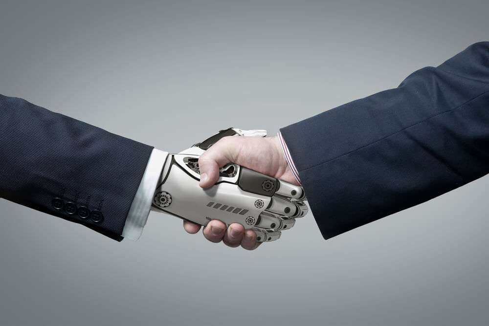 robot hand shaking hands with a human hand